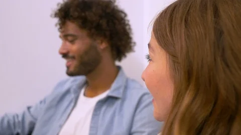 Close-up of creative business people talking while sitting on sofa in office Video stock 114872203