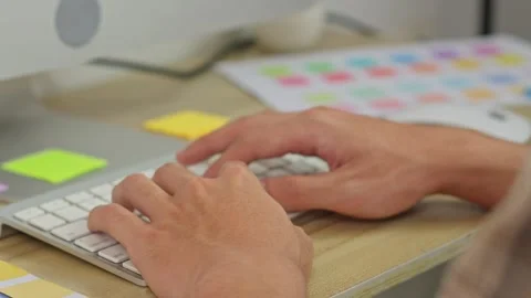 Close up of creative designer hands typing on desktop keyboard at home office Stock Footage 337121862