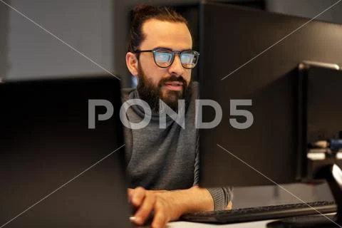 Close up of creative man working at night office Stock Photos