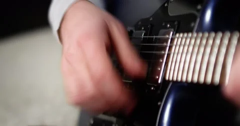 Close-up creative musician playing fingerpicking with on a blue electric guitar. Stock Footage 169643344