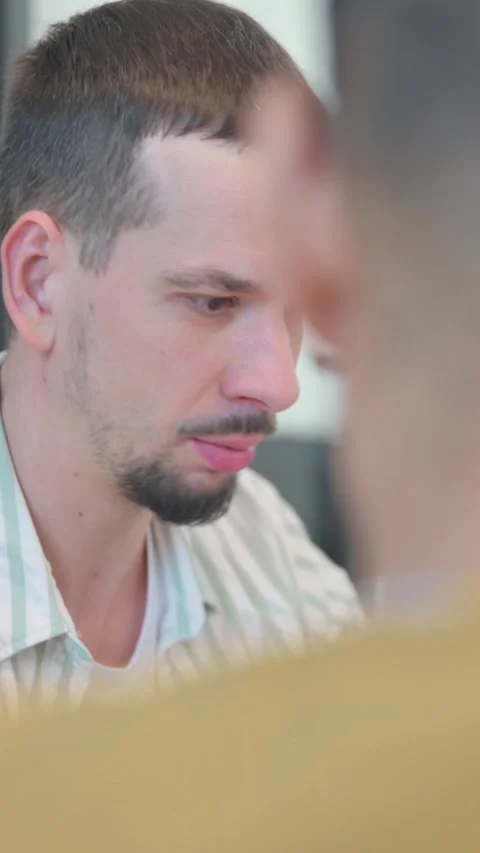 Close up of Creative People Talking during Meeting, vertical video 動画素材 325563438