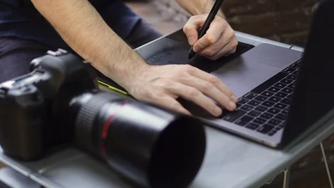 Close up of creative photographer using graphic tablet for retouching. Stock Footage 125307139