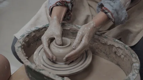Close-up on creativity. Top view of potter making ceramic on the pottery wheel Video stock 98547243