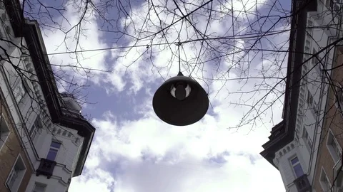 Close up of a creepy old rusty outside lamp post with a blinking light bulb Stock Footage 127579548