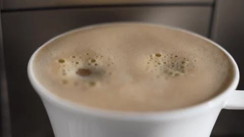 Close-up of crema forming on a fresh cup of coffee. Stock Footage 320728097