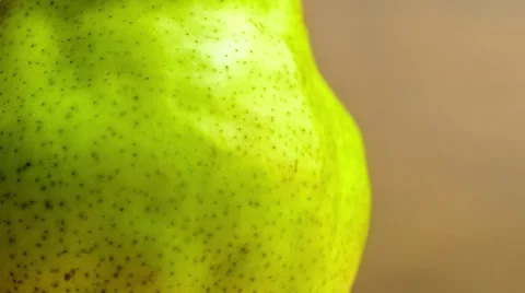 Close up of crisp green pear being drenched with water mist, slow motion vide Stock Footage 62715006