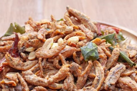Close up of Crispy deep fried small fish on plate Stock Photos