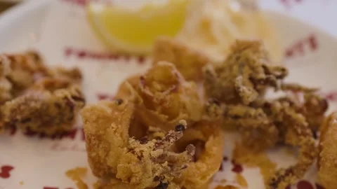 Close Up of Crispy Fried Calamari with Lemon and Dipping Sauce Stock Footage 329145013