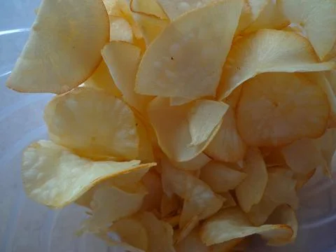 A close-up of crispy fried cassava chips Fotos de archivo