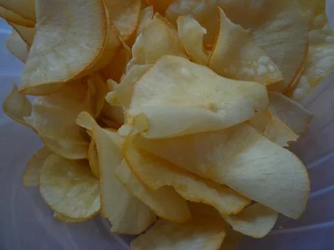 A close-up of crispy fried cassava chips Foto stock
