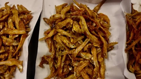 Close-Up Crispy Fried Small Fish in Paper Tray Street Food Thailand 4K Stock-Footage 331774445