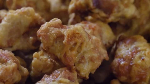 Close-Up of Crispy Golden Brown Popcorn Chicken Bites Video stock 343027031
