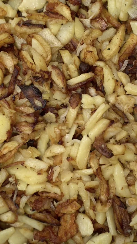Close-up of crispy golden fried potatoes with onions. Homemade style Stock Footage 342299977