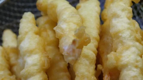 Close Up of Crispy Golden Fried Shrimp Tempura or Korean Fried Chicken Tenders i Video stock 343028917