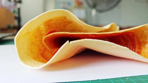 Close up of crispy Japanese style folded crepe with sauce. 스톡 동영상 338009475