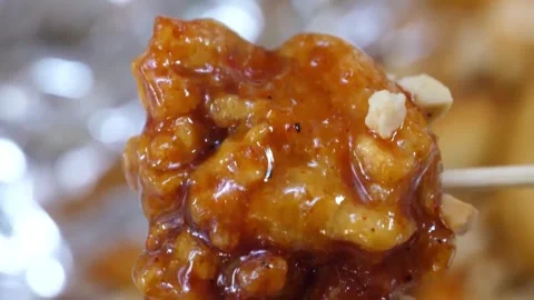 Close-up of Crispy Korean Fried Chicken (Dakgangjeong) Coated in Sweet and Spicy Stock-Footage 343027056