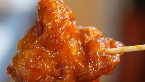 Close-up of Crispy Korean Fried Chicken (Dakgangjeong) Glazed in Spicy Sweet Sau Video stock 343027597