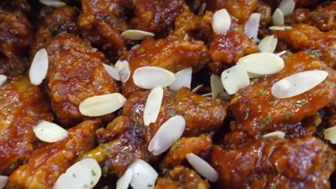 Close-Up of Crispy Korean Fried Chicken (Dakgangjeong) Coated in Glossy Sweet Sp Video stock 343027815
