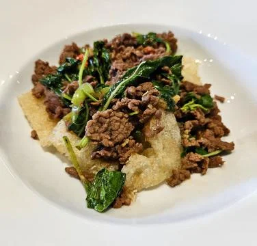 Close up Crispy rice flat noodles with beef or pork stir fried and basil Stock Photos