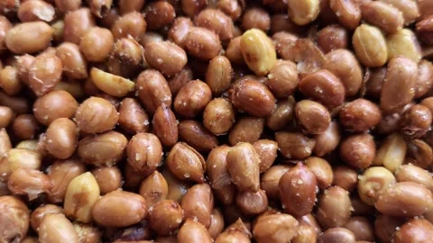 Close-up of crispy roasted peanuts with salt sprinkles Stock Footage 336737805