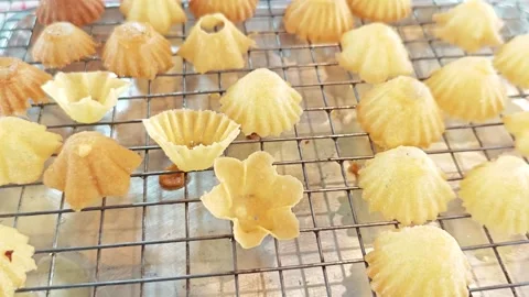 Close-up of crispy Thai flower pastry cups Krathong Thong on a rack. Video stock 343222662