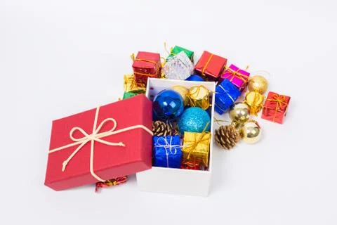 Close up of Cristmas present box with some colorful papper and toys Stock Photos