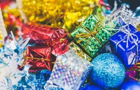 Close up of Cristmas present box with some colorful papper and toys Stock Photos