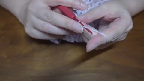 Close-up of Crocheting a Triangular Cotton Shawl, Back View Stock Footage 331632915