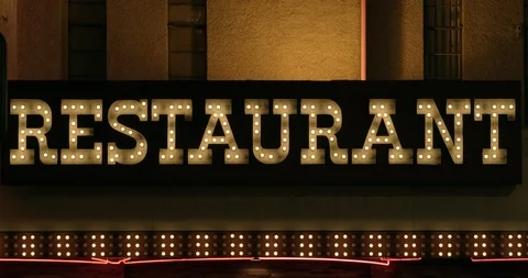 Close crop of a light bulb sign saying RESTAURANT Stock Footage 120650087
