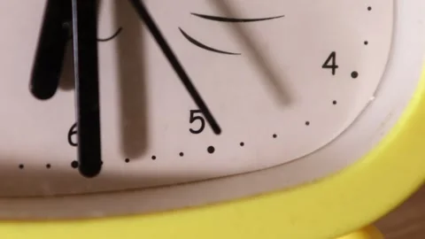 Close cropped analog clock face with white dial, black hands, partial numerals Stock Footage 345434978