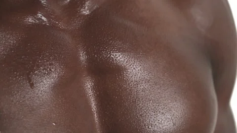 Close-up cropped front view shot of a tired sporty muscular sweaty man's chest. Stock-Footage 133782890