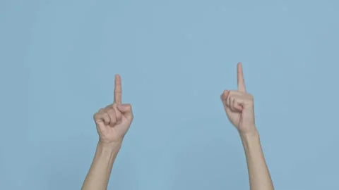 Close up cropped man hand showing thumb up gesture sign isolated on blue back Video stock 149813460