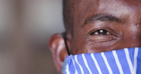 Close-up cropped portrait view of a Black African man wearing a face mask  Stock Footage 133923709
