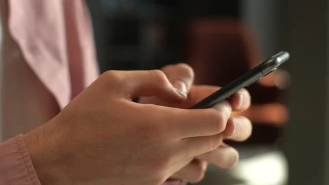 Close-up cropped shot hands of unrecognizable male using smartphone indoors Stock Footage 227184084