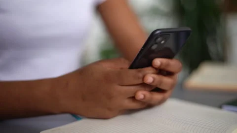 Close-up cropped shot of unrecognizable black female using smartphone, texting Stock Footage 170364769