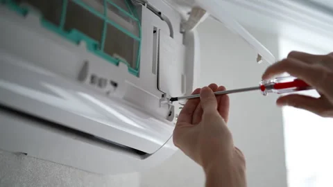 Close-up cropped shot of unrecognizable engineer using screwdriver while setting Stock Footage 267602367