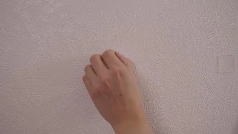 Close-up cropped shot of unrecognizable handyman peeling protective film from Stock Footage 324865658