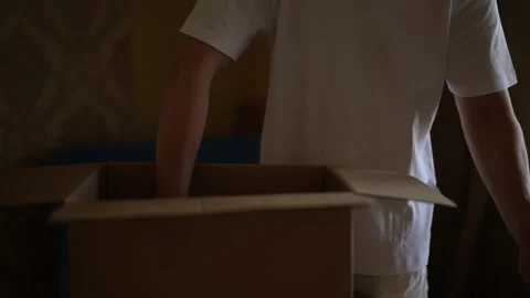 Close-up cropped shot of unrecognizable man carefully placing frying pan into Stock Footage 293512950