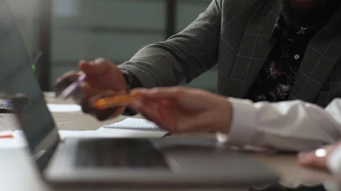 Close-up cropped shot of unrecognizable multiethnic male and female colleagues Stock Footage 247821027