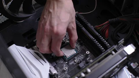 Close-up cropped shot of unrecognizable technician male master removing CPU Stock Footage 234003384