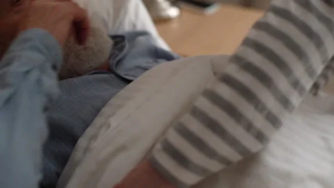 Close-up cropped shot of unrecognizable young granddaughter covering sick Stock Footage 166154970
