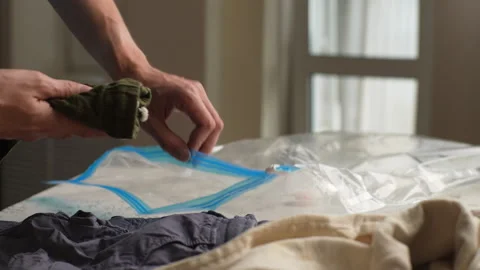 Close-up cropped shot of unrecognizable young male dad putting folded children Stock Footage 247901852