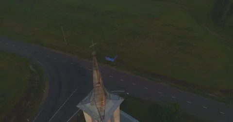 Close up of cross on catholic church on sunset. Aerial footage. Stock Footage