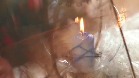 Close up cross effect candle burns in the bottles. Summer homemade decoration. Stock Footage 186979646