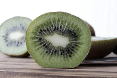 Close-up cross section of a kiwi fruit. Stock Photos