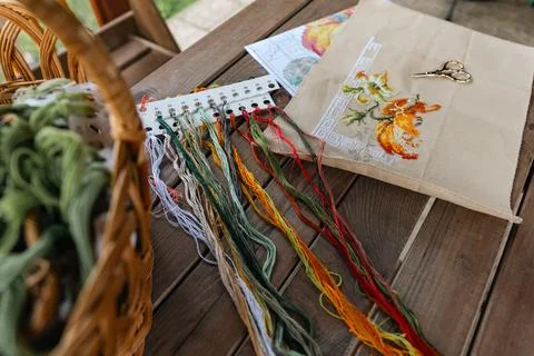 Close-up of a cross-stitch in progress. Cross-stitch with various colorful th Stock Photos