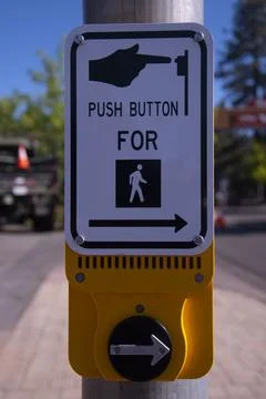 Close up on a crosswalk push button. Stock Photos