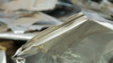Close-up of crumpled metal sheets with a soft focus background, panning Video stock 281318967