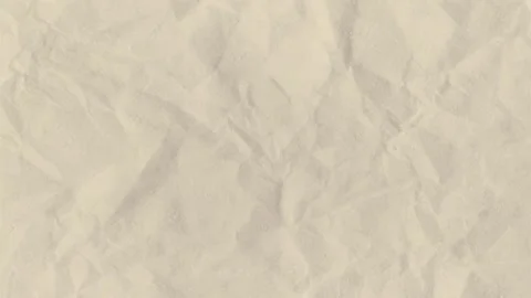 Close-up of crumpled paper with textured surface. Video stock 340756480