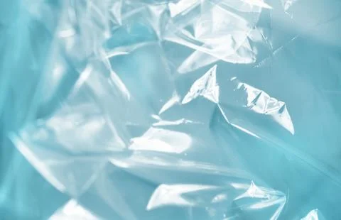Close-up of crumpled translucent blue plastic with light reflections, creat.. Stock Photos